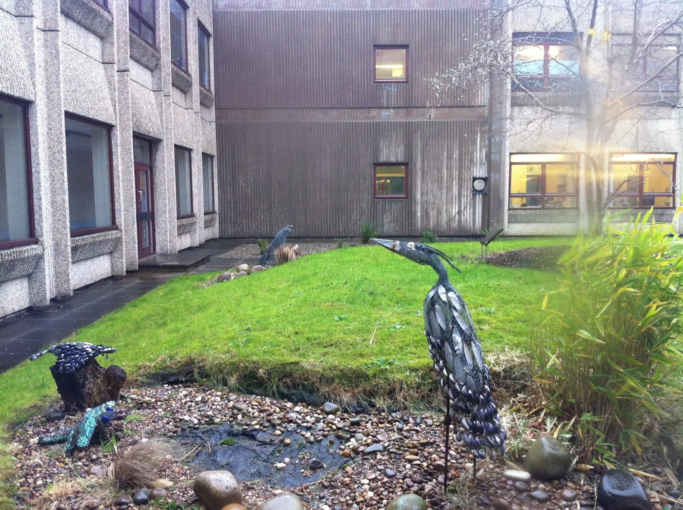 Sculpture in a courtyard garden at Warrington Hospital on Lovely Lane, photographed in 2011. The trust that runs the hospital recorded 882 patients waiting more than 12 hours for a bed in August 2026
