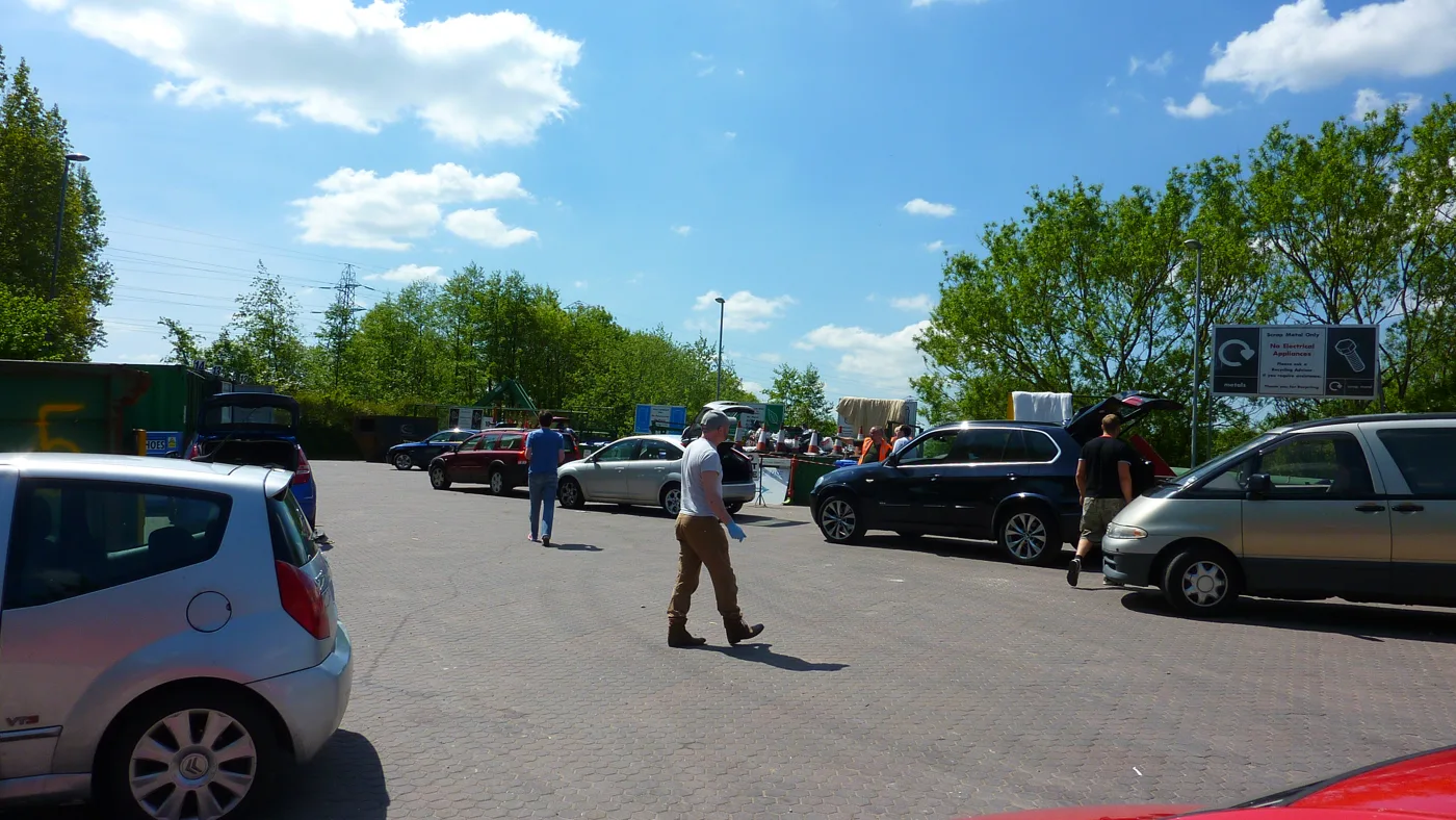 Cars unloading at Woolston Community Recycling Centre on New Cut Lane, one of Warrington's three council-run tips.